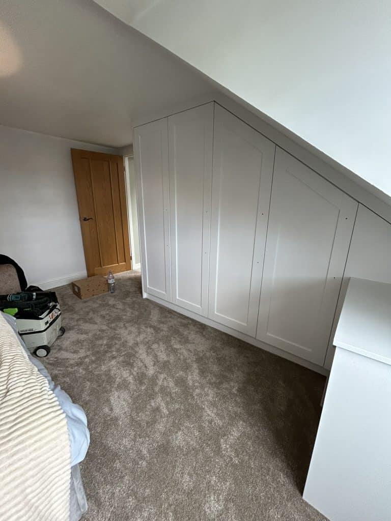Another angle of fitted wardrobe