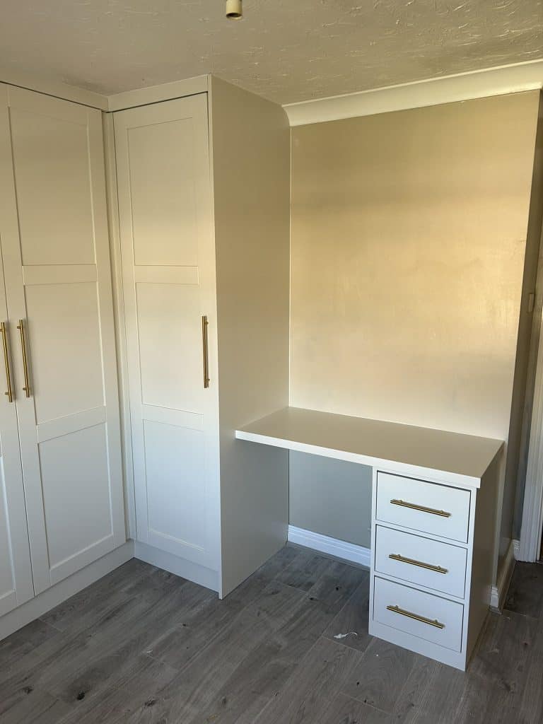 Wardrobe that incorporates a sleek desk.